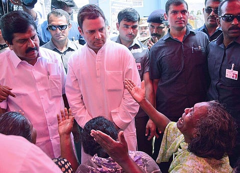 Rahul Gandhi consoling family members of scores of dead and missing fishermen after Cyclone Okhi hit the Poonthura coast in Thiruvananthapuram and many places in Kerala and southern Tamilnadu. Local MLA V S Shivakumar is also seen. (Express Photo | BP De