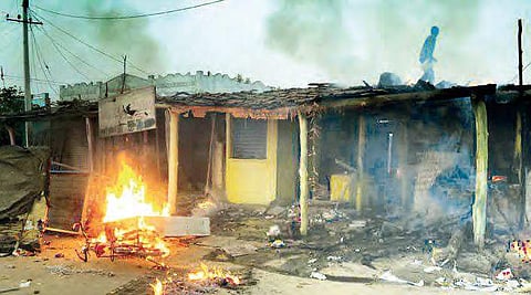 Protestors set fire to a wine shop during the clash in Utnoor on Friday | Express Photo
