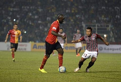 East Bengal's Ivan Bukenya (L) controls the ball past Mohun Bagan's Jeje Lalpekhlua (R) during an Indian I-League football match between Mohun Bagan and East Bengal at the Kanchenjungha Stadium in Siliguri on February 12, 2017. | AFP