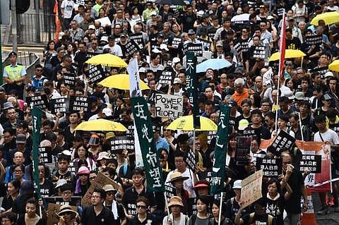 Pro-independence activists in Hong Kong (FileHONG KONG: Hong Kong have been fined $3,000 after fans jeered the Chinese national anthem during an Asia Cup match last month, the third time they have been punished for booing. Fans have taken to booing the