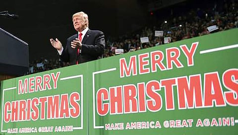 FILE - In this Dec. 8, 2017, file photo, President Donald Trump takes to the stage at a campaign-style rally at the Pensacola Bay Center, in Pensacola. | AP