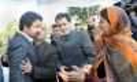 Newly inducted minister Tassaduq Mufti, brother of CM Mehbooba Mufti, being greeted by relatives after the swearing-in ceremony at Raj Bhavan in Jammu | pti