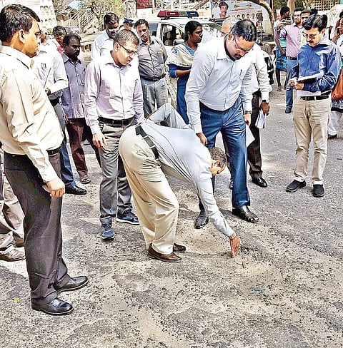 A member of the Central team inspecting a road that was damaged following the Northeast monsoon at Jermaiah road in Veppery on Thursday | ASHWIN PRASATH