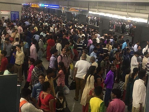Metro passengers waiting at Rajiv Chowk metro station. (ANI)