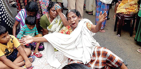 The relative of a fisherman, who died at sea during Ockhi, laments at his residence at Valiyathura in Thiruvananthapuram on Saturday. | Kaviyoor Santhosh