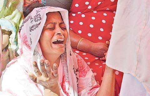 A family member of a Cyclone Ockhi victim grieves. (Express File Photo)