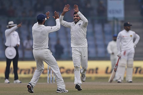 India's Ravindra Jadeja celebrates with Cheteshwar Pujara the wicket of Sri Lanka's Dimuth Karunaratne | AP