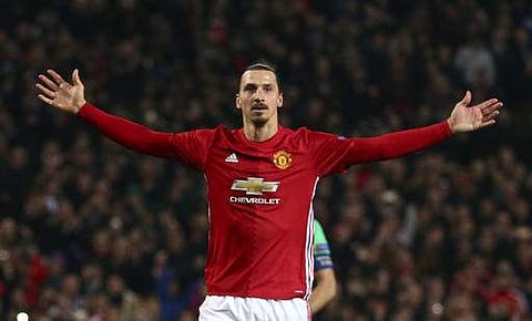 Manchester United's Zlatan Ibrahimovic celebrates after scoring during the Europa League round of 32 first leg soccer match between Manchester United and St.-Etienne. (AP)