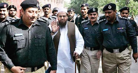 JuD chief Hafiz Saeed being taken away by Pakistan police (File | PTI)