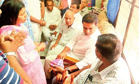 KT Rama Rao with family members of Srinivas in Hyderabad on Saturday | Express
