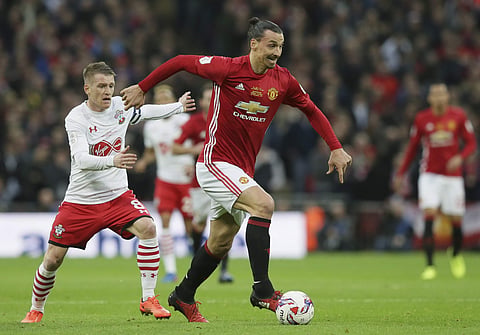 United's Zlatan Ibrahimovic runs with the ball during the English League Cup final soccer match between Manchester United and Southampton FC at Wembley stadium in London. | AP
