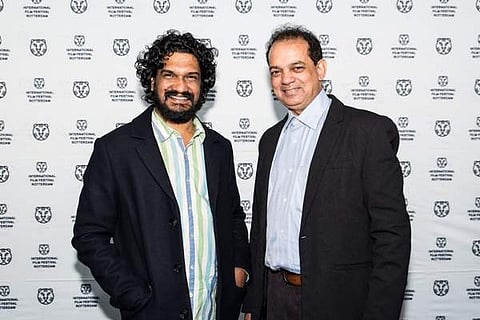 Director Sanal Kumar Sasidharan (Left)(Photo via IFFR twitter Handle)