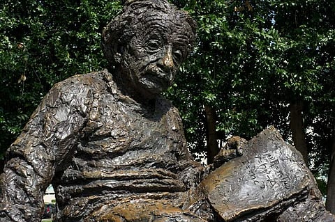 The Albert Einstein Memorial is a monumental bronze statue depicting Einstein seated with manuscript papers in hand by sculptor Robert Berks. | AFP