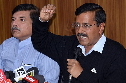 Delhi Chief Minister Arvind Kejriwal with party leader Sanjay Singh addressing a press conference at his residence in New Delhi on Wednesday. | PTI