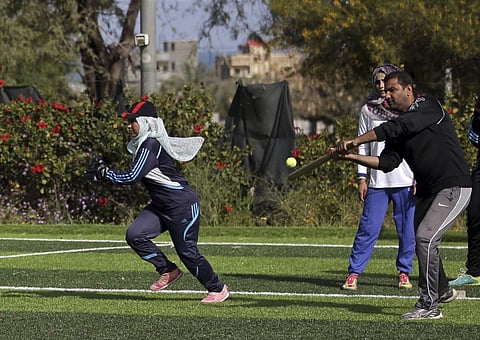 Palestinian women train for an all women's baseball game, on a soccer field, in Khan Younis, southern Gaza Strip. (AP)