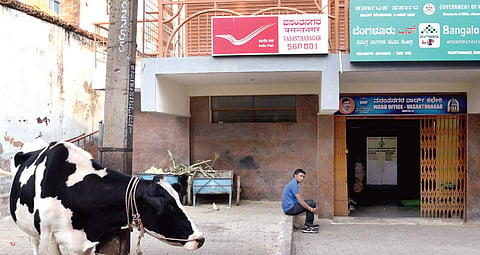 (Above) The new post office in BBMP complex and (right) shops where the old one stood still carry the older pincode 560052 Vinod Kumar T