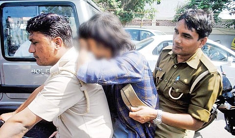 The ‘Anti-Romeo Squad’ of Uttar Pradesh police take a youth into custody for eve-teasing, in Lucknow on Wednesday | pTI