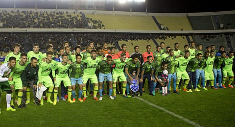 Players of Brazil's Chapecoense and Bolivia's Bolivar pose together for photos prior to a friendly soccer match at Hernando Siles stadium in La Paz, Bolivia, Saturday, March 25, 2017. | AP