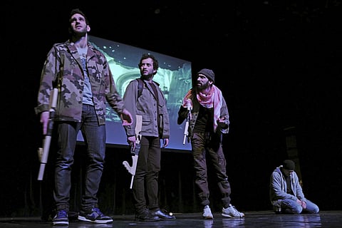 Actors perform in 'Djihad', a play about three young Muslims who come to regret their decision to go to Syria but who also feel rejected by Europe, in Lens, northern France, Monday March. 13, 2017 . | AP