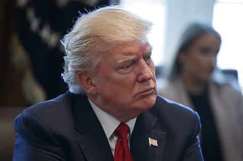 President Donald Trump listens in the Cabinet Room of the White House in Washington, Wednesday, March 29, 2017. | AP