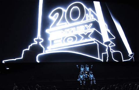 Illuminated performers pose onstage at the start of 20th Century Fox's presentation at CinemaCon 2017 at Caesars Palace on March 30 in Las Vegas. (Photo | AP)