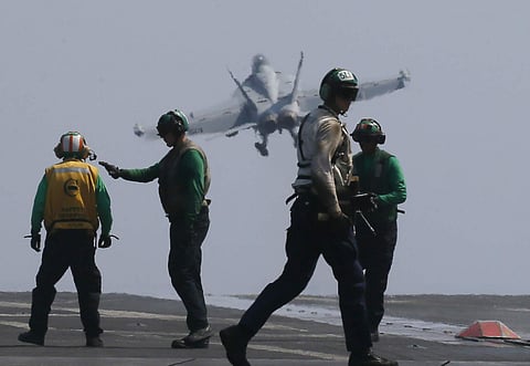 A U.S. Navy F18 fighter jet from the U.S. Navy aircraft carrier USS Carl Vinson (CVN 70) for a patrol off the disputed South China Sea Friday, March 3, 2017. (Photo | AP)