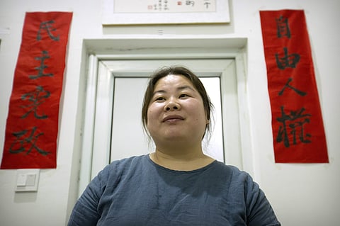 Ye Haiyan poses for a photo on in her art studio on the outskirts of Beijing. (File Photo | AP)