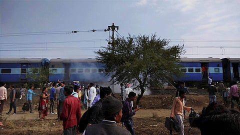 Smoke erupts from a bogie after a blast in the Bhopal-Ujjain passenger train near Jabdi station in Shajapur district in Madhya Pradesh. | PTI