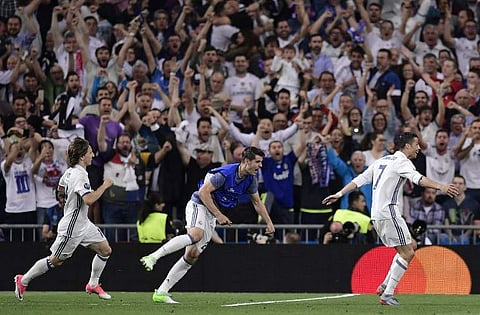 Real Madrid's Portuguese forward Cristiano Ronaldo (R) celebrates a goal | AFP