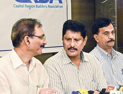 Builders associations JAC office-bearers during a media conference in Vijayawada on Saturday | Express