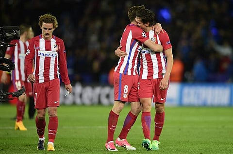 Atletico Madrid's French forward Antoine Griezmann, Atletico Madrid's Spanish midfielder Saul Niguez and Atletico Madrid's Montenegrin defender Stefan Savic | AFP