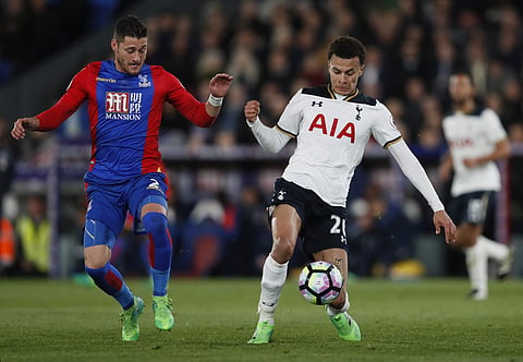 Tottenham's Dele Alli, right, with Crystal Palace's Joel Ward during the English Premier League soccer match between Crystal Palace and Tottenham Hotspur at Selhurst Park stadium in London, Wednesday, April 26, 2017. | AP