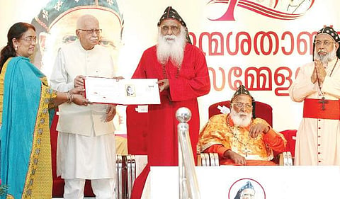 Senior BJP leader and former Deputy Prime Minister L K Advani releasing the special stamp cover during the centenary birth celebrations of Philipose Mar Chrysostom Mar Thoma Valiya Metropolitan at Tiruvalla on Thursday | SHAJI VETTIPURAM