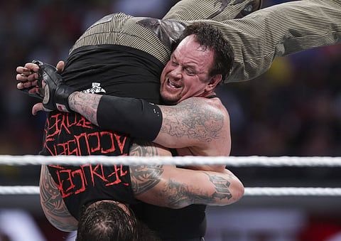 In this March 29, 2015, file photo, Bray Wyatt is upended by his opponent, The Undertaker, at Wrestlemania XXXI in Santa Clara, Calif. |AP