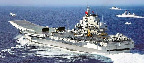 Chinese aircraft carrier Liaoning berthed at an unnamed port