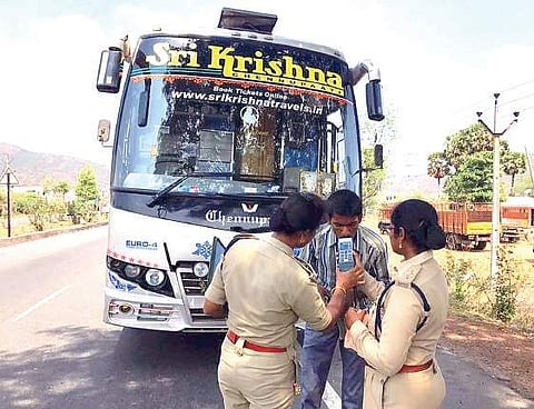 Police conducting a breathalyser test on a bus driver in Visakhapatnam on Tuesday | Express