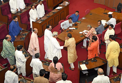 Chief Minister Naveen Patnaik ushers Pradip Amat to the Speaker’s chair in the Assembly in Bhubaneswar on Tuesday | Express