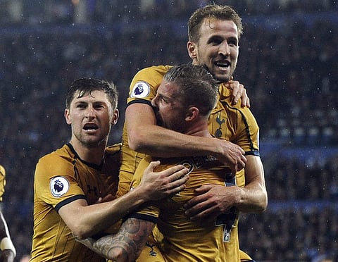 Tottenham's Harry Kane, top, celebrates scoring his second goal during the English Premier League soccer match between Leicester City and Tottenham Hotspur at the King Power Stadium in Leicester, England, Thursday, May 18, 2017. | AP