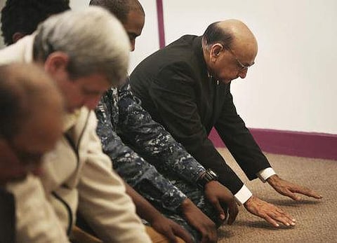 (File image for representation only | AP) Khizr Khan (right most), whose son Army Capt. Humayun Khan was killed in Iraq and who criticized Donald Trump's statements on Muslims, joins in prayer at a mosque in Virginia.