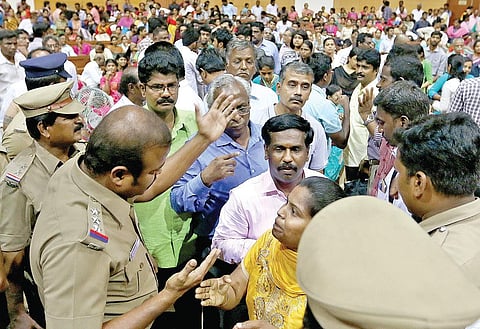 Doctors, who came to attend PG counseling for self-financing colleges, arguing with the police and selection committee officials over the non-availability of enough seats on Tuesday | Express