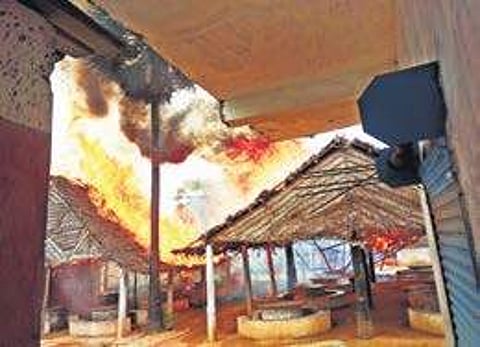 A liquor bar that was set on fire by locals who are against the opening of new outlets, at Soriyankuppam in Puducherry on Wednesday | Express