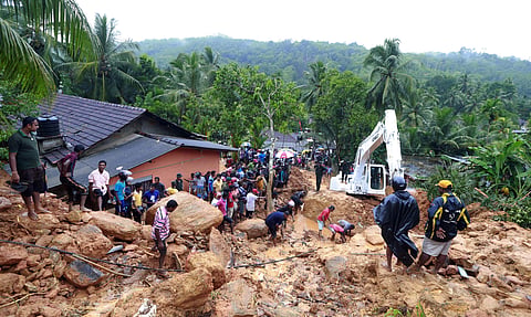 The police said the workers, employed by a private real estate group, were carrying out excavation work when the mud collapsed because of heavy rain.