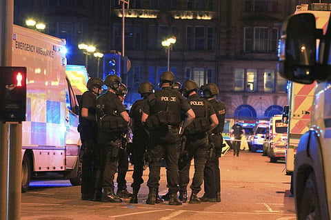 Armed police and ambulance services at the suspected terrorist attack site in Manchester Arena on Tuesday. | AP