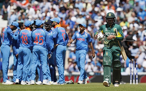 India's player celebrate taking the wicket of South Africa's Quinton de Kock, right, during the ICC Champions Trophy match between India and South Africa at The Oval cricket ground in London, Sunday, June 11, 2017. | AP