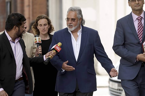 Former Indian politician and billionaire businessman Vijay Mallya centre arrives for his extradition hearing arrives at Westminster Magistrates Court in London Tuesday June 13 2017. | AP
