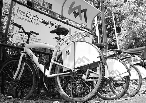 Public bike-sharing system which allows commuters to use bicycles free of cost to travel short distances within city limits | Express