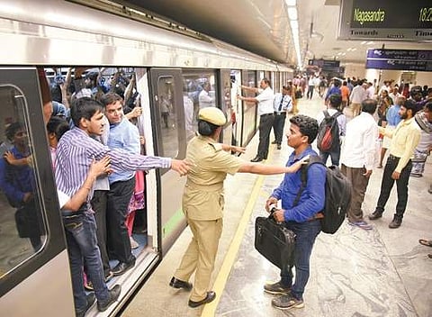 Crowd management was a huge task for security personnel at Kempe Gowda Metro Station, on Monday| Nagaraja Gadekal
