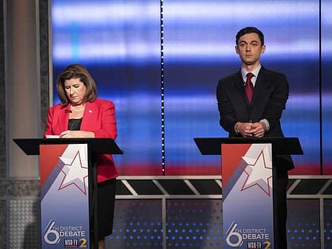 Candidates in Georgia's 6th Congressional District race Republican Karen Handel, left, and Democrat Jon Ossoff prepare to debate in Atlanta on June 6. (File Photo | AP)