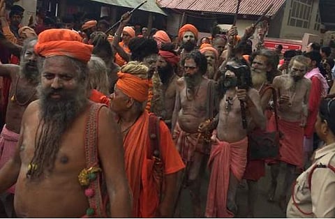 Bending tradition: Naga sadhus don clothes at Kamakhya temple