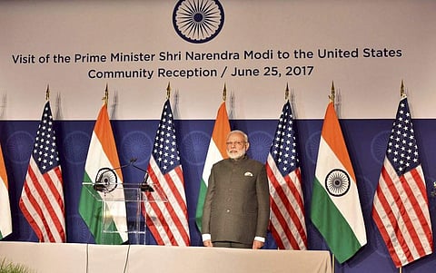 Prime Minister Narendra Modi stands for the national anthem during the United States Community Reception in Washington DC USA on Sunday. | PTI